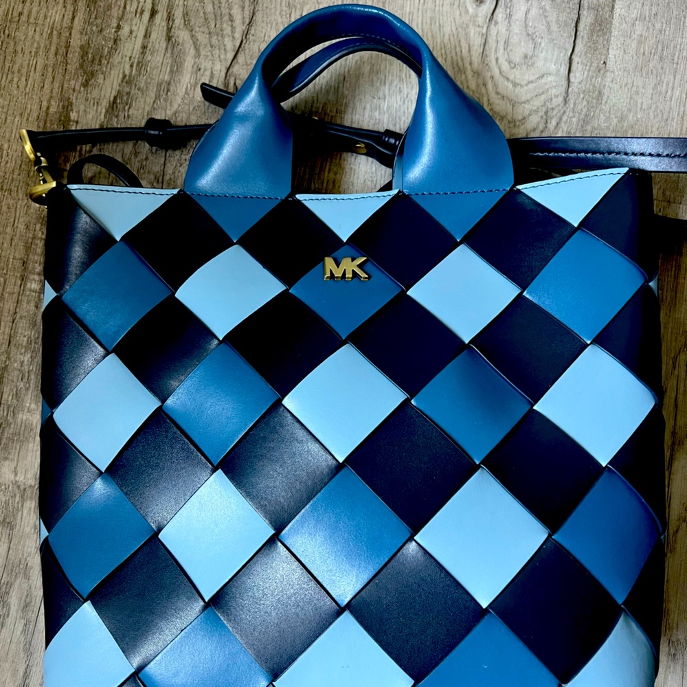 Michael Kors handbag in 3 shades of blue.  13” across, 10.5” tall, 3.5” wide.